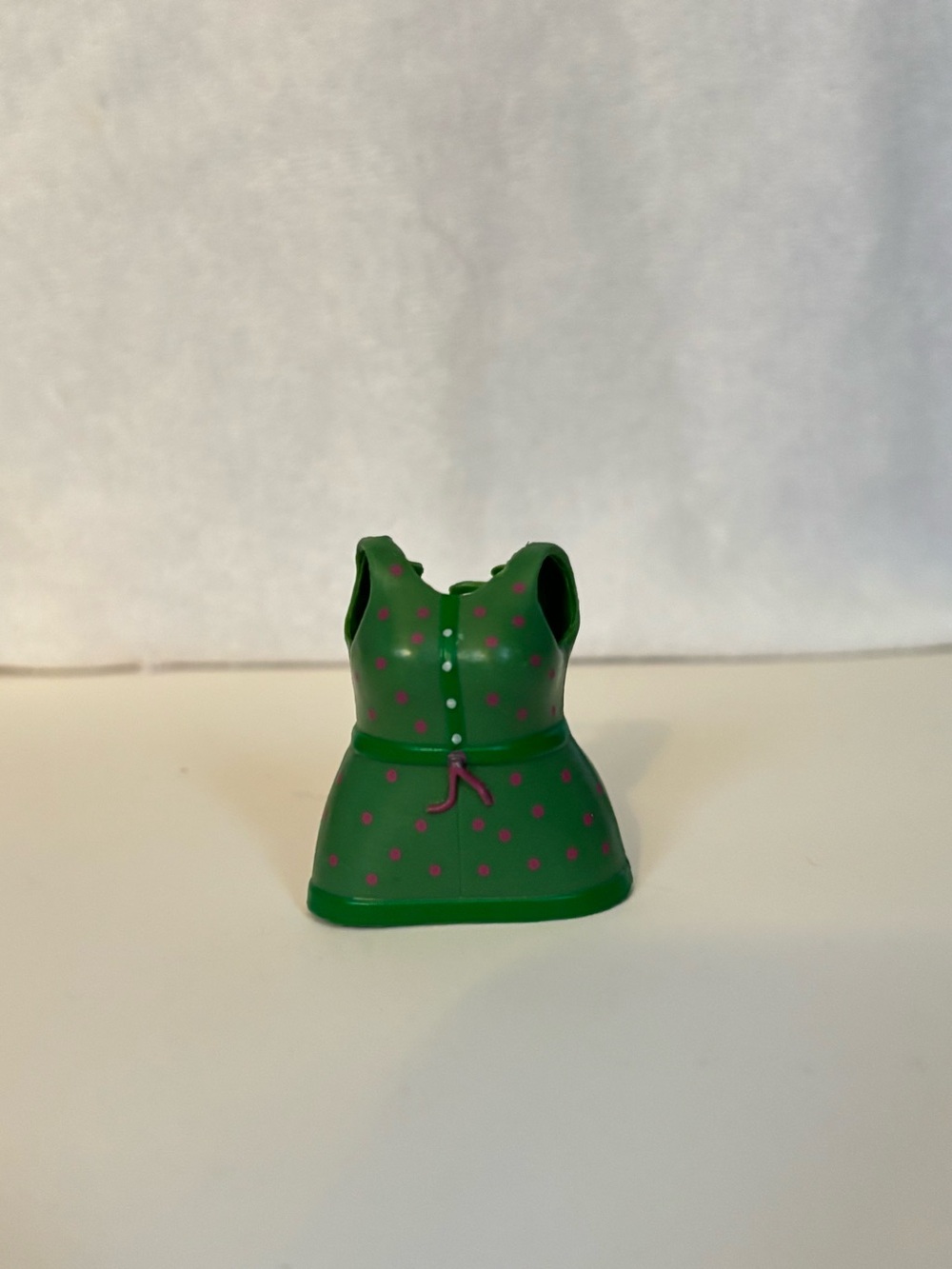 Lego Green dress with pink polka dots and pink ribbon.